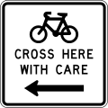 New_Zealand_General_Advisory_-_Cyclists_Cross_Here_With_Care_(left).svg