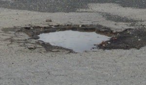tarmac-pot-hole-with-puddle