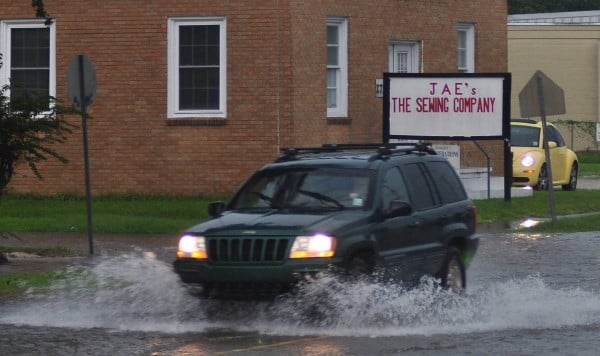 suv driving through flood water