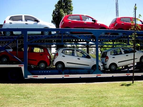 Cars are driven onto the car transporter to be transported long distances by road
