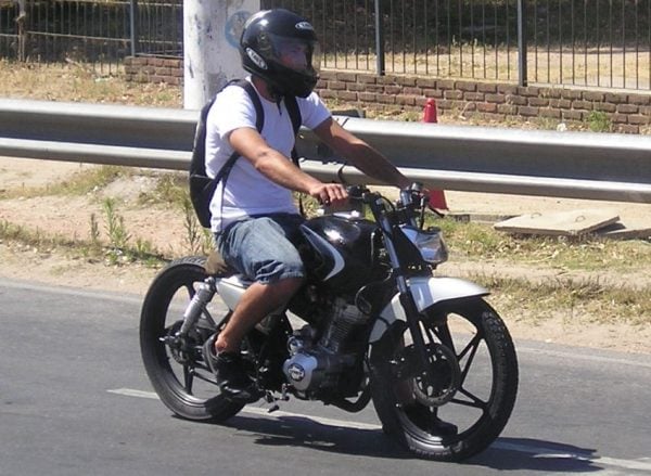 This rider is risking serious injury and permanent scarring by not wearing the right safety equipment, even though it's hot