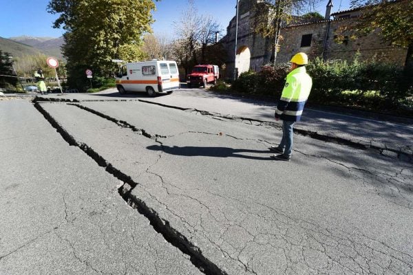 An earthquake can cause large cracks in the road like this