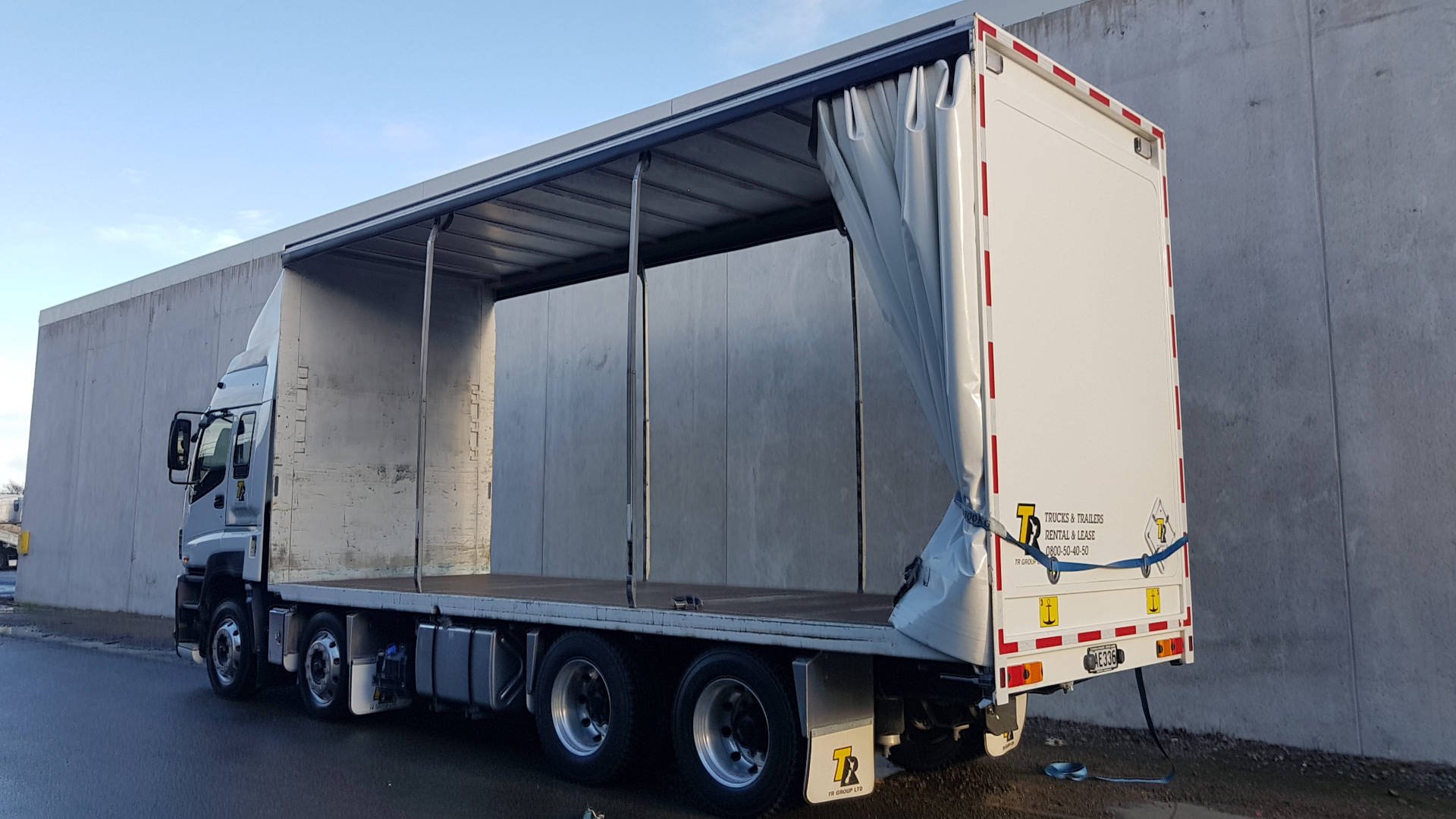 How do you drive a highsided vehicle in high winds?