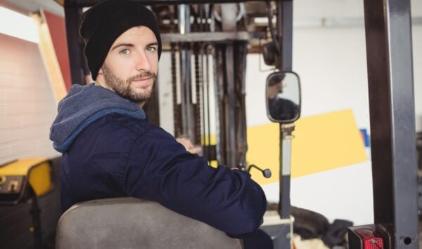 Forklift operator wearing a beanie