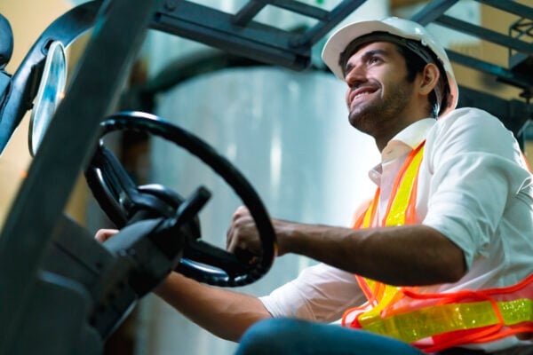 Forklift operator wearing a hard hat