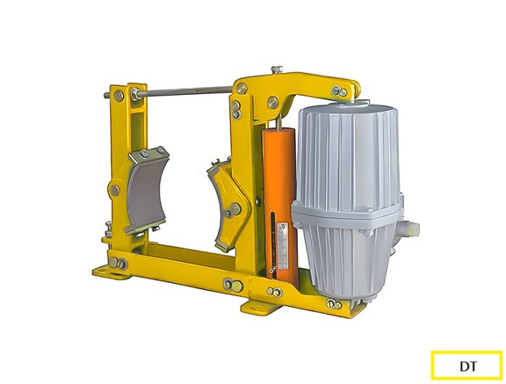 A close-up view of an electro-hydraulic brake unit used in cranes. The device includes a yellow steel frame, brake shoes, an orange hydraulic cylinder, and a gray motor housing. This system is designed to control and stop crane movements by applying mechanical braking force.